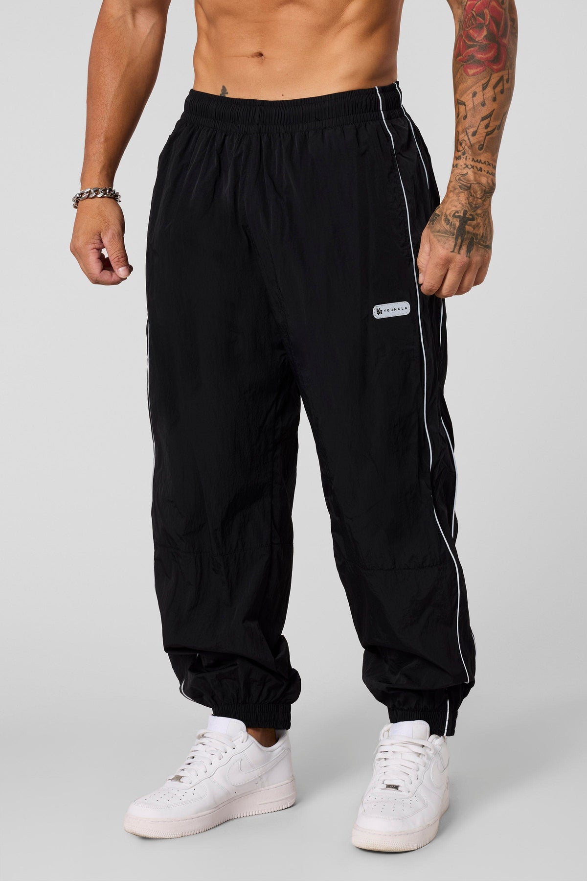 2091 - Retro Cuffed Joggers - Relaxed, lightweight joggers with breathable fabric and cuffed hems. Perfect for training or everyday wear, with a versatile, retro-inspired silhouette in Black.