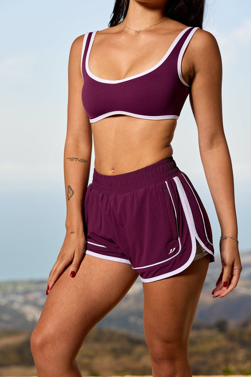 W175 - Elevate Running Shorts for woman the adjustable drawstring and pocket waistband with color Grape.