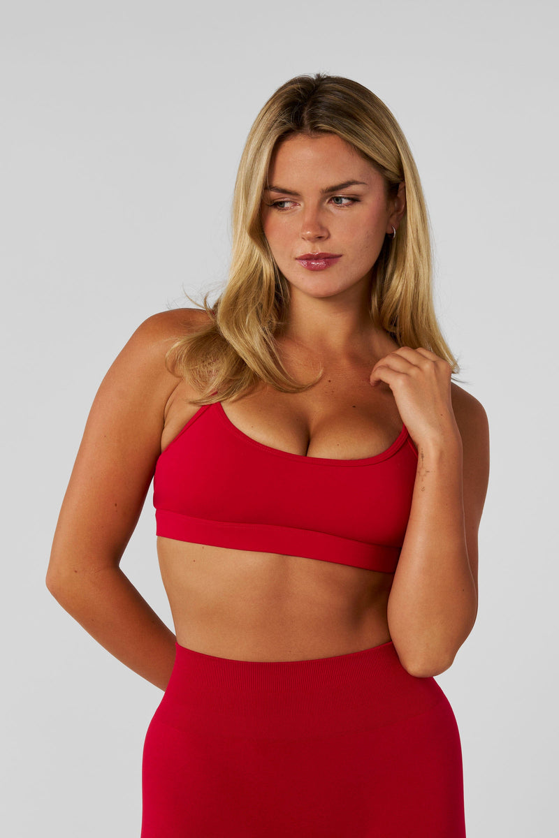 W351 (New Colors) Legacy Sports Bra for women With adjustable straps, a clean, minimal design in color Red.