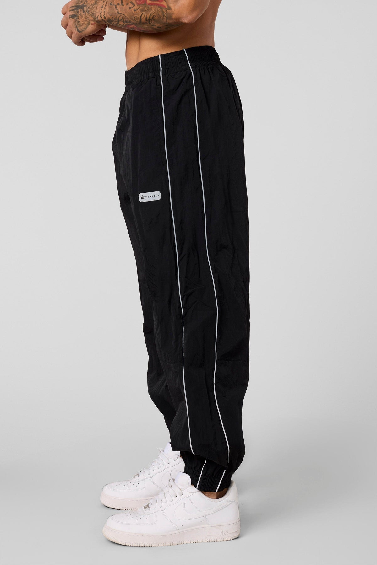 2091 - Retro Cuffed Joggers - Relaxed, lightweight joggers with breathable fabric and cuffed hems. Perfect for training or everyday wear, with a versatile, retro-inspired silhouette in Black.