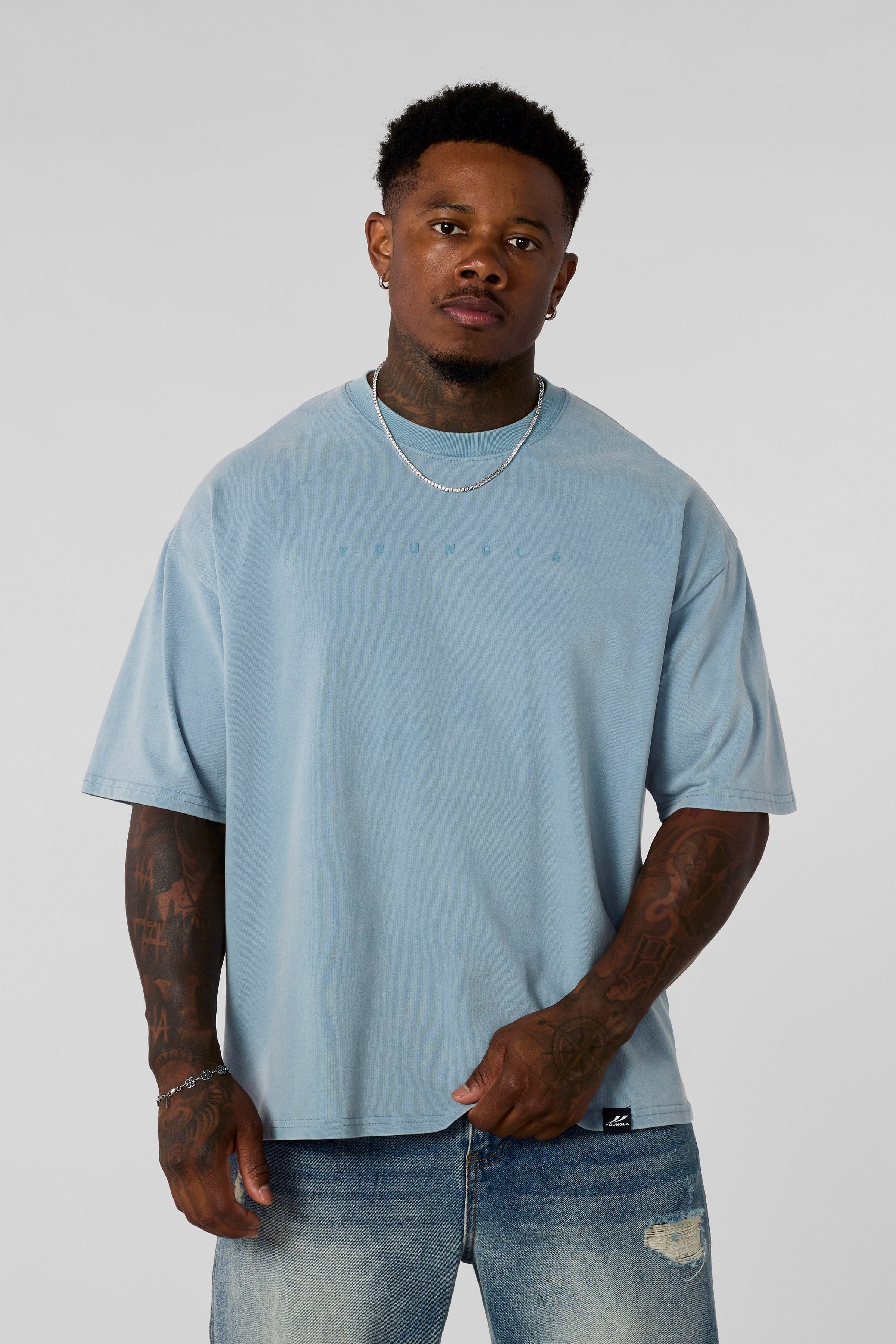 4219 - Summer Peached Tees for Men: 100% cotton garment-washed tee with buttery-soft hand feel, smooth drape, laid-back fit, and perfect for everyday layering in color Light blue wash.